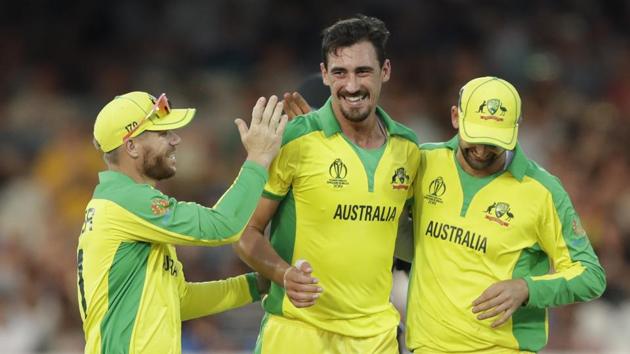 Australia's Mitchell Starc, centre, celebrates with teammates.(AP)