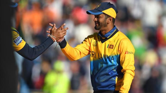 Sri Lanka's captain Dimuth Karunaratne (R) celebrates with his players. (AFP) Sri Lanka's captain Dimuth Karunaratne (R) celebrates with his players. (AFP)