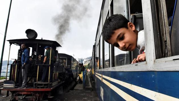 A boy looks out of a DHR train. It is polpularly known by the name ‘Toy Train’ whis is in fact never an official term it is just a popular expression found in literature. Like tea and the Ghurka culture, the DHR has become an essential feature of the landscape and an enduring part of Darjeeling’s identity. (Ranita Roy / REUTERS)