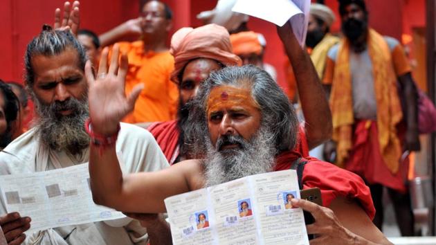 Jammu, India - June 29, 2019: Sadhus wait to get themselves registered for an annual pilgrimage on the first day of registration for Amarnath Yatra at Ram Mandir Base Camp, in Jammu, Jammu and Kashmir, India, on Saturday, June 29, 2019. The 40-day pilgrimage yatra to the cave shrine at an altitude of 3,880 metre in the south Kashmir Himalayas will commence from both the routes from July 1. (Photo by Nitin Kanotra / Hindustan Times)