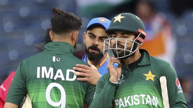 India's captain Virat Kohli, center, greets Pakistan players at the end of the Cricket World Cup match between India and Pakistan at Old Trafford in Manchester, England, Sunday, June 16, 2019.(AP)