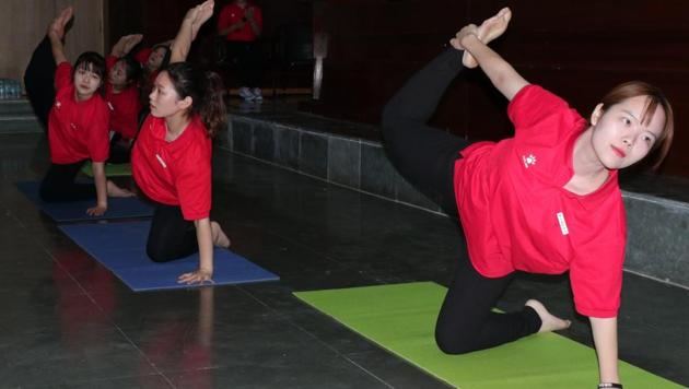 Chinese students, faculty learn Yoga at Sharda University in Greater Noida  - Hindustan Times
