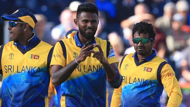 Sri Lanka's Isuru Udana (C) gestures to his finger as he celebrates with teammates. (AFP)