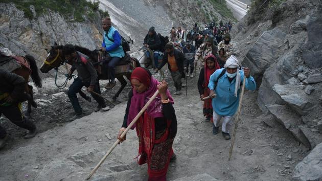 The annual pilgrimage to Amarnath cave shrine in South Kashmir Himalayas began on Monday under tight security. The first batch of 2,234 pilgrims arrived in Baltal and Pahalgam, the base camps for the pilgrimage in Ganderbal and Anantnag districts, on Sunday. They began trekking to the shrine located 3,888 metres above sea level on Monday. (ANI) The annual pilgrimage to Amarnath cave shrine in South Kashmir Himalayas began on Monday under tight security. The first batch of 2,234 pilgrims arrived in Baltal and Pahalgam, the base camps for the pilgrimage in Ganderbal and Anantnag districts, on Sunday. They began trekking to the shrine located 3,888 metres above sea level on Monday. (ANI)