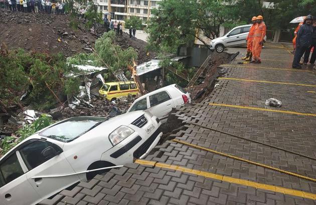 A dislodged car at the site where a portion of the compound wall of a housing society collapsed on shanties adjacent to it in Kondhwa on June 29. 15 people, including four children, were killed.(HT/PHOTO) A dislodged car at the site where a portion of the compound wall of a housing society collapsed on shanties adjacent to it in Kondhwa on June 29. 15 people, including four children, were killed.(HT/PHOTO)