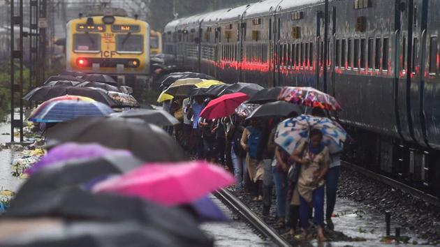 Heavy rains during the night and on Monday morning in Mumbai and its outskirts inundated low-lying areas, delayed trains and slowed down vehicular movement. Two days of downpour helped the city surpass its average rainfall for June. Between 8.30am on Friday and 8.30am on Sunday, Mumbai recorded 327.5mm rain, compared to 182mm received in the first 27 days of June. (Shashank Parade / PTI) Heavy rains during the night and on Monday morning in Mumbai and its outskirts inundated low-lying areas, delayed trains and slowed down vehicular movement. Two days of downpour helped the city surpass its average rainfall for June. Between 8.30am on Friday and 8.30am on Sunday, Mumbai recorded 327.5mm rain, compared to 182mm received in the first 27 days of June. (Shashank Parade / PTI)