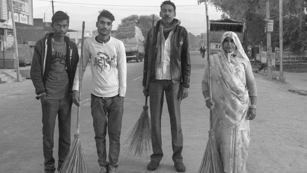 Santosh Valmik (third from left) survived a septic tank accident in 1992. “We usually drink before we take a plunge into such tanks in order to help us cope with the smell,” he says. Now he works with his wife (right) and two sons as a regular Safai Karamchari. (Sudharak Olwe)