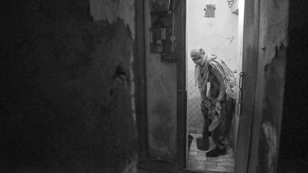 Veiling her face and hair with her purple dupatta, 42-year-old Mukeshdevi enters the toilet and cleans it with bare hands. Mukeshdevi and her husband Sukhraj somehow manage to make ends meet with their income of less than rupees 10,000 every month. (Sudharak Olwe)