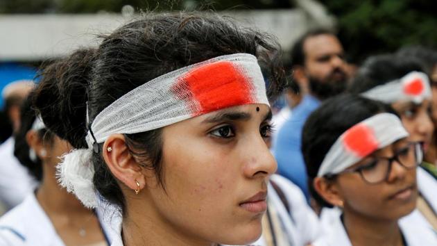 Medical students wearing mock bandages participate in a protest called by Indian Medical Association (IMA), during a nationwide doctors strike.(REUTERS) Medical students wearing mock bandages participate in a protest called by Indian Medical Association (IMA), during a nationwide doctors strike.(REUTERS)