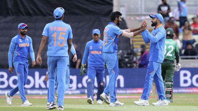 India's Jasprit Bumrah, without cap, celebrates with India's captain Virat Kohli after dismissing Bangladesh's Mosaddek Hossain. (AP) India's Jasprit Bumrah, without cap, celebrates with India's captain Virat Kohli after dismissing Bangladesh's Mosaddek Hossain. (AP)