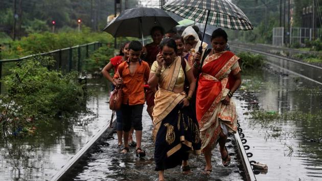 Mumbai was left paralaysed by the incessant rain on Tuesday, which left several areas of the financial capital waterlogged. Heavy rains lashing Mumbai since Sunday have thrown rail, air and road traffic out of gear, with several trains being cancelled. With IMD forecasting heavy rains for Tuesday, the authorities declared a holiday in the city and adjoining regions, asking people to avoid stepping out of their houses. (Francis Mascarenhas / REUTERS) Mumbai was left paralaysed by the incessant rain on Tuesday, which left several areas of the financial capital waterlogged. Heavy rains lashing Mumbai since Sunday have thrown rail, air and road traffic out of gear, with several trains being cancelled. With IMD forecasting heavy rains for Tuesday, the authorities declared a holiday in the city and adjoining regions, asking people to avoid stepping out of their houses. (Francis Mascarenhas / REUTERS)