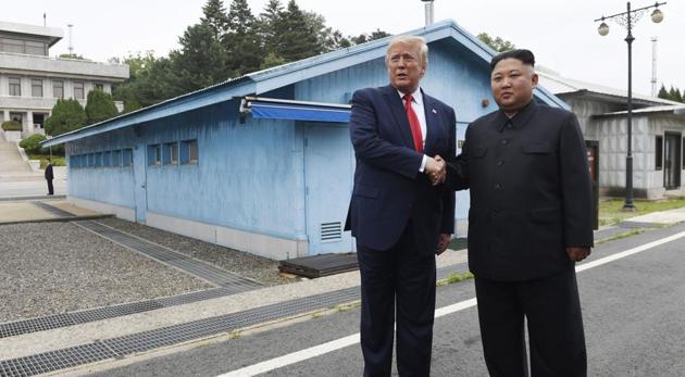 US President Donald Trump meets with North Korean leader Kim Jong Un at the border village of Panmunjom in the Demilitarized Zone, South Korea, Sunday, June 30, 2019(AP)