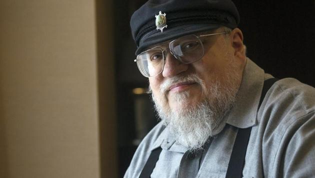 George R.R. Martin, author of the popular book series A Song of Ice and Fire, poses in Toronto.(AP) George R.R. Martin, author of the popular book series A Song of Ice and Fire, poses in Toronto.(AP)