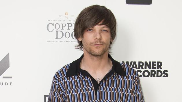 Singer Louis Tomlinson poses for photographers upon arrival at the screening for As it Was.(Joel C Ryan/Invision/AP)