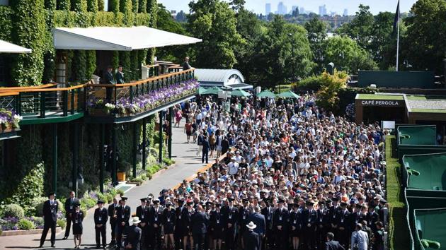 Spectators queue, in true British style, to enter The All England Tennis Club in Wimbledon on the first day of the 2019 Wimbledon Championships. Only a limited number of tickets are available daily for Centre Court and courts No. 1 and No. 2, except for the last four nailbiting days when all are sold in advance. (Daniel Leal-Olivas / AFP)