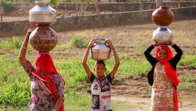 In many places in Rajasthan women have to walk long distances to collect water.(PTI)