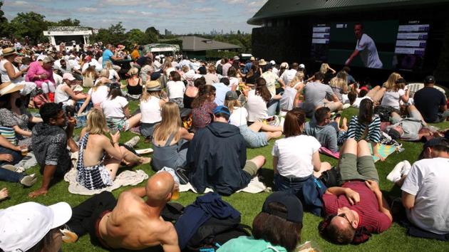 Spectators watch the action on a big screen. If past years trends repeat themselves, nearly half a million spectators will turn up to watch their favourite players in action in the days to come. A total attendance of 473,169 across 13 days was recorded in 2018. (Carl Recine / REUTERS)