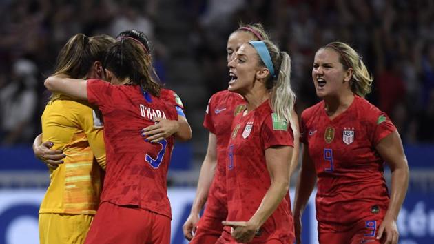 United States' goalkeeper Alyssa Naeher (L) is congratulated by teammates after saving a penalty kick during the France 2019 Women's World Cup semi-final football match between England and USA.(AFP)