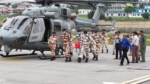 ITBP personnel carry the bodies of climbers at Naini Saini airport in Pithoragarh where they were brought down on Wednesday morning by IAF choppers.