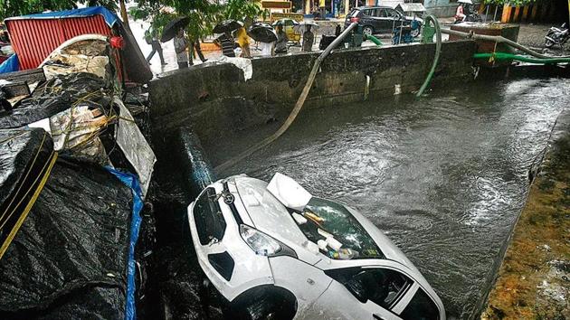 A car got washed away into a drainage near Andheri subway in Mumbai, India, on Tuesday, July 2, 2019. (Photo by Shashi S Kashyap/ HT PHOTO)