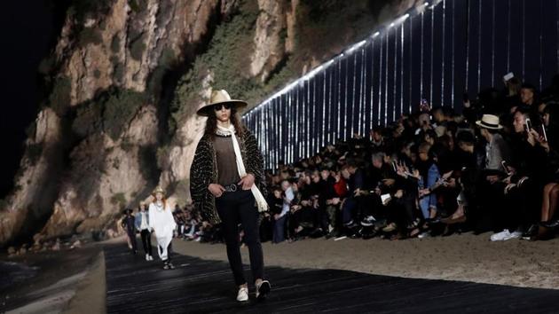 A model presents creations at the Saint Laurent Men’s Spring/Summer 2020 fashion show at Paradise Cove beach in Malibu, California, U.S., June 6, 2019.(REUTERS/Mario Anzuoni)