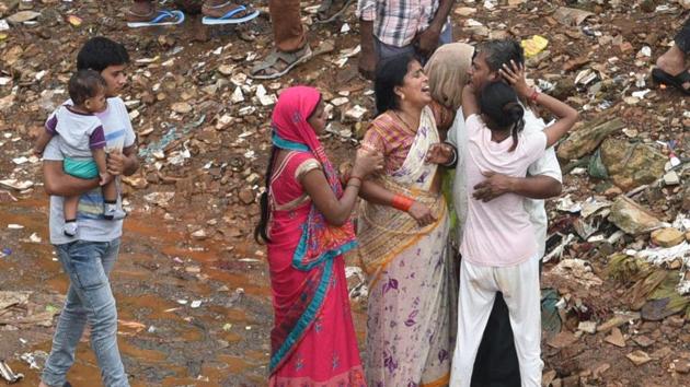 People mourning the death of their relatives in the wall collapse at Kurar Village,Malad , in Mumbai on Tuesday, July 2, 2019.(Pramod Thakur / HT Photo)