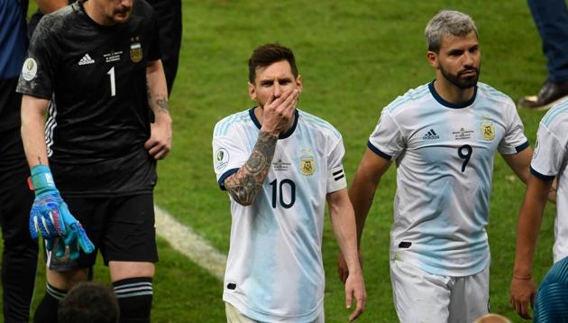 Argentina's Lionel Messi (C), Sergio Aguero (R) and goalkeeper Franco Armani (L) leave the field after losing 2-0 to Brazil in a Copa America football tournament semi-final match at the Mineirao Stadium in Belo Horizonte, Brazil, on July 2, 2019(AFP)