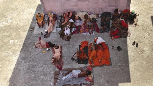 Hindu holy men take rest at a base camp for the annual pilgrimage in Jammu on July 1, 2019. The pilgrims, many of them barefooted ascetics, chanted hymns and rang bells as they travelled through forested areas in Kashmir’s Himalayas. (Channi Anand / AP) Hindu holy men take rest at a base camp for the annual pilgrimage in Jammu on July 1, 2019. The pilgrims, many of them barefooted ascetics, chanted hymns and rang bells as they travelled through forested areas in Kashmir’s Himalayas. (Channi Anand / AP)