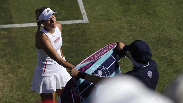 Germany's Angelique Kerber reaches for her towel.(AP)