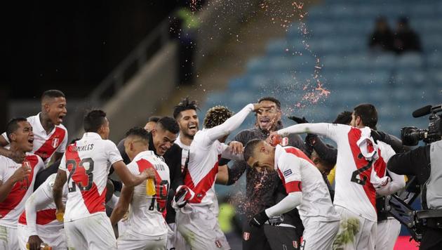 Peru's players celebrates their side's win over Chile during a Copa America semifinal(AP)