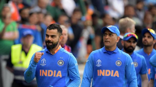 India's captain Virat Kohli (L) leads his team as they celebrate after victory in the 2019 Cricket World Cup group stage match between Bangladesh and India at Edgbaston in Birmingham.(AFP)