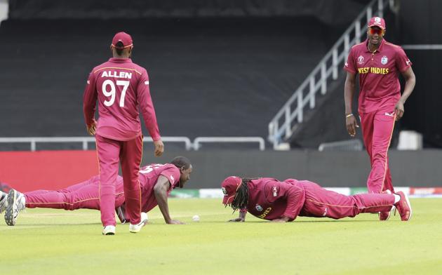 Leeds: West Indies' captain Jason Holder, right, watches teammates celebrate the dismissal of Afghanistan's Rahmat Shah. (AP) Leeds: West Indies' captain Jason Holder, right, watches teammates celebrate the dismissal of Afghanistan's Rahmat Shah. (AP)