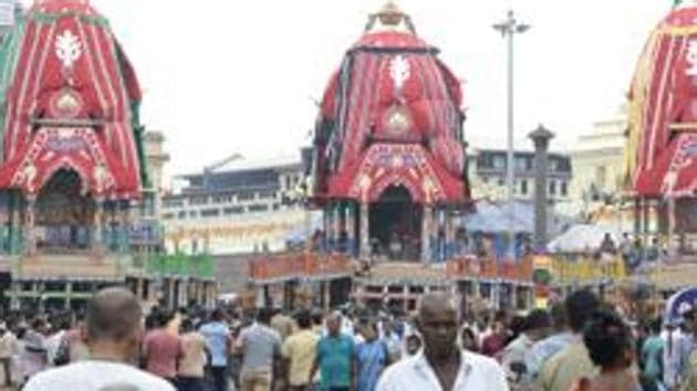 Devotees stand outside the Lord Jagannath temple ahead of the Rath Yatra in Puri on Wednesday.(ANI) Devotees stand outside the Lord Jagannath temple ahead of the Rath Yatra in Puri on Wednesday.(ANI)