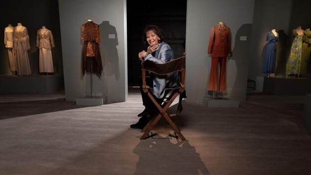 Italo-Tunisian actress Claudia Cardinale poses during a photo session at the Sotheby's showroom next to dresses and outfits from her wardrobe that will go on auction, on July 2, 2019 in Paris. - The wardrobe of screen legend Claudia Cardinale is to go under the hammer in Paris next week, with the star saying her clothes show "the liberation of women". (Photo by Lionel BONAVENTURE / AFP)(AFP)
