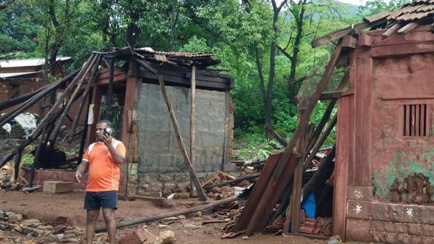 A man stands next to destroyed buildings in the path of the water from the breached Tiware dam near Chiplun in Ratnagiri, Maharashtra. Two more bodies were found on Thursday after rescuers resumed their search for the missing people after the Tiware dam gave away late on Tuesday, officials said. The death toll has gone up to 16 and seven people are yet to be found. (AFP) A man stands next to destroyed buildings in the path of the water from the breached Tiware dam near Chiplun in Ratnagiri, Maharashtra. Two more bodies were found on Thursday after rescuers resumed their search for the missing people after the Tiware dam gave away late on Tuesday, officials said. The death toll has gone up to 16 and seven people are yet to be found. (AFP)