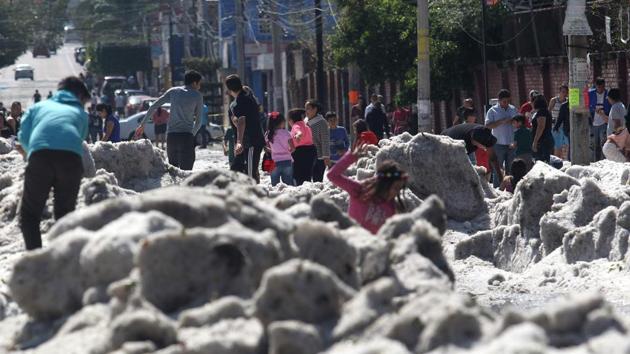 People are seen in a street of Guadalajara, Mexico, after a hail storm fell in the area.(AFP File Photo) People are seen in a street of Guadalajara, Mexico, after a hail storm fell in the area.(AFP File Photo)
