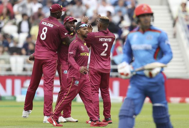 West Indies players celebrate the dismissal of Afghanistan's Mohammad Nabi,. (AP) West Indies players celebrate the dismissal of Afghanistan's Mohammad Nabi,. (AP)