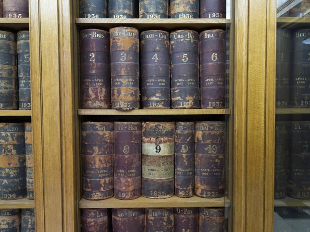 A collection of leather bound ledgers recording the bank’s transactions dating back centuries sit on display at C. Hoare & Co. (Bryn Colton / Bloomberg)