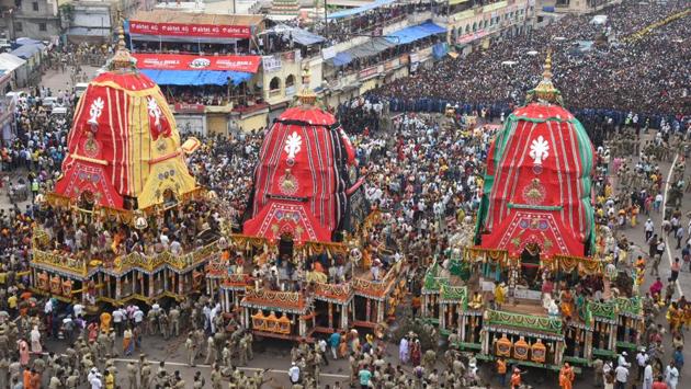 Millions of devotees gathered in Puri for the annual Rath Yatra of Lord Jagannath on Wednesday amid heightened security as the nine-day annual celebrations began in Odisha’s temple town. The chariots of Lord Jagannath, his elder brother Lord Balabhadra and younger sister Devi Subhadra were pulled by the devotees on the streets called Badadanda as people played drums, trumpets and sang devotional songs. (Arabinda Mahapatra / HT Photo) 