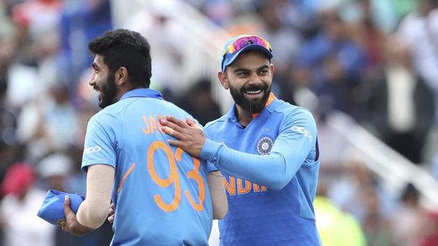 IVirat Kohli, right, celebrates with teammate Jasprit Bumrah (AP) IVirat Kohli, right, celebrates with teammate Jasprit Bumrah (AP)