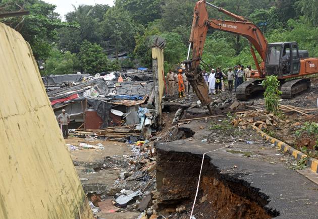 Parts of the retaining wall that were still standing after the collapse were also demolished on Wednesday.(Satyabrata Tripathy/HT Photo)