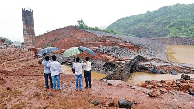 Officials of the irrigation department visit the breached Tiware dam near Chiplun in Ratnagiri, on Thursday. An SIT will now investigate if construction was faulty.(Pratham Gokhale/HT Photo)