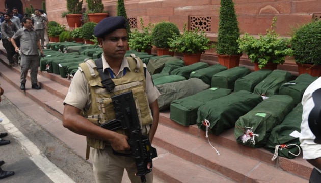 Security personnel check budget papers on Parliament House premises on Friday.(Raj K Raj/ HT photo)