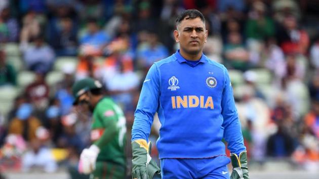 India's Mahendra Singh Dhoni gestures during the 2019 Cricket World Cup group stage match between Bangladesh and India at Edgbaston in Birmingham, central England, on July 2, 2019.(AFP)