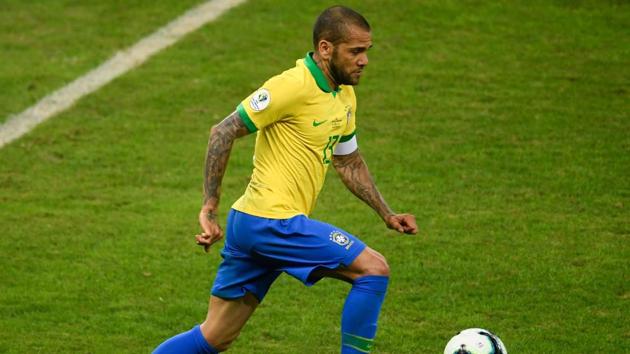 Brazil's Dani Alves drives the ball during the Copa America semi-final match against Argentina at the Mineirao Stadium in Belo Horizonte.(AFP)