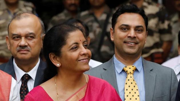 India's Finance Minister Nirmala Sitharaman (C) and Krishnamurthy Subramanian (R), chief economic adviser pose during a photo opportunity outside their office before the presentation of the federal budget in the parliament in New Delhi.(REUTERS)