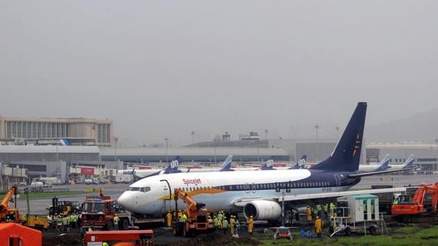 The SpiceJet Boeing 737 aircraft, which was stuck between the main runway and grass area after skidding off on arrival at the airport in Mumbai on Monday, has been pulled back to the runway, paving the way for full-fledged operations at the aerodrome, officials said. The country’s second busiest airport has been carrying out flight operations from the secondary runway (PTI) The SpiceJet Boeing 737 aircraft, which was stuck between the main runway and grass area after skidding off on arrival at the airport in Mumbai on Monday, has been pulled back to the runway, paving the way for full-fledged operations at the aerodrome, officials said. The country’s second busiest airport has been carrying out flight operations from the secondary runway (PTI)