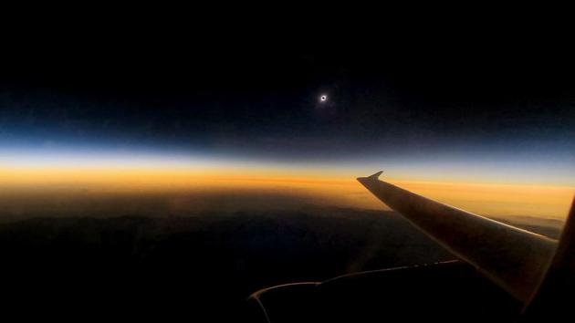 View of the total solar eclipse from a commercial flight while overflying La Serena, Chile. Tens of thousands of tourists braced Tuesday for a rare total solar eclipse that was expected to turn day into night along a large swath of Latin America’s southern cone, including much of Chile and Argentina. (Ariel Marinkovic / AFP) View of the total solar eclipse from a commercial flight while overflying La Serena, Chile. Tens of thousands of tourists braced Tuesday for a rare total solar eclipse that was expected to turn day into night along a large swath of Latin America’s southern cone, including much of Chile and Argentina. (Ariel Marinkovic / AFP)