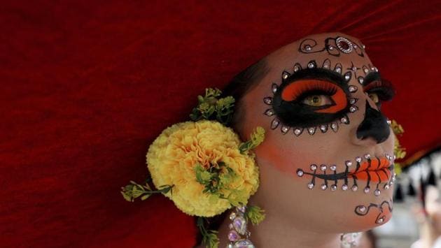 A reveler dressed as a Mexican “catrina” participates in the gay pride parade in Bogota, Colombia. Thousands paraded during the annual gay pride parade in support of peace and against sexual discrimination. (Fernando Vergara / AP) A reveler dressed as a Mexican “catrina” participates in the gay pride parade in Bogota, Colombia. Thousands paraded during the annual gay pride parade in support of peace and against sexual discrimination. (Fernando Vergara / AP)