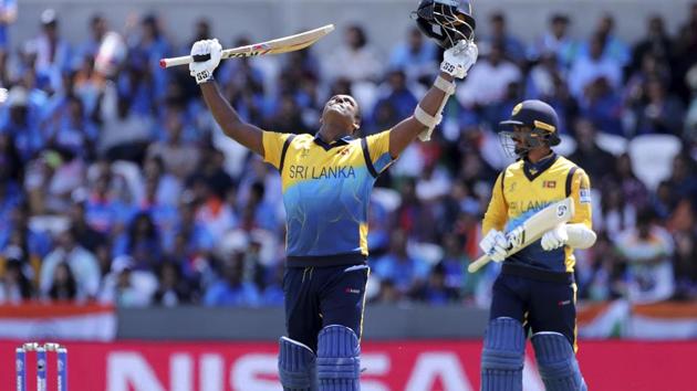 Sri Lanka's Angelo Mathews, left, celebrates scoring a century during.(AP)